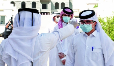 Students are seen getting their temperature checked